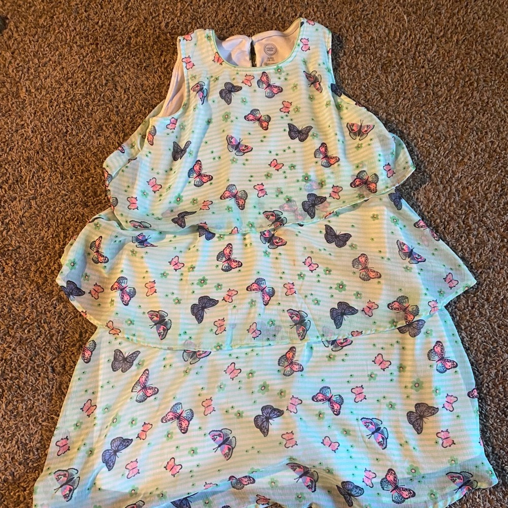Mint green tiered butterfly dress.